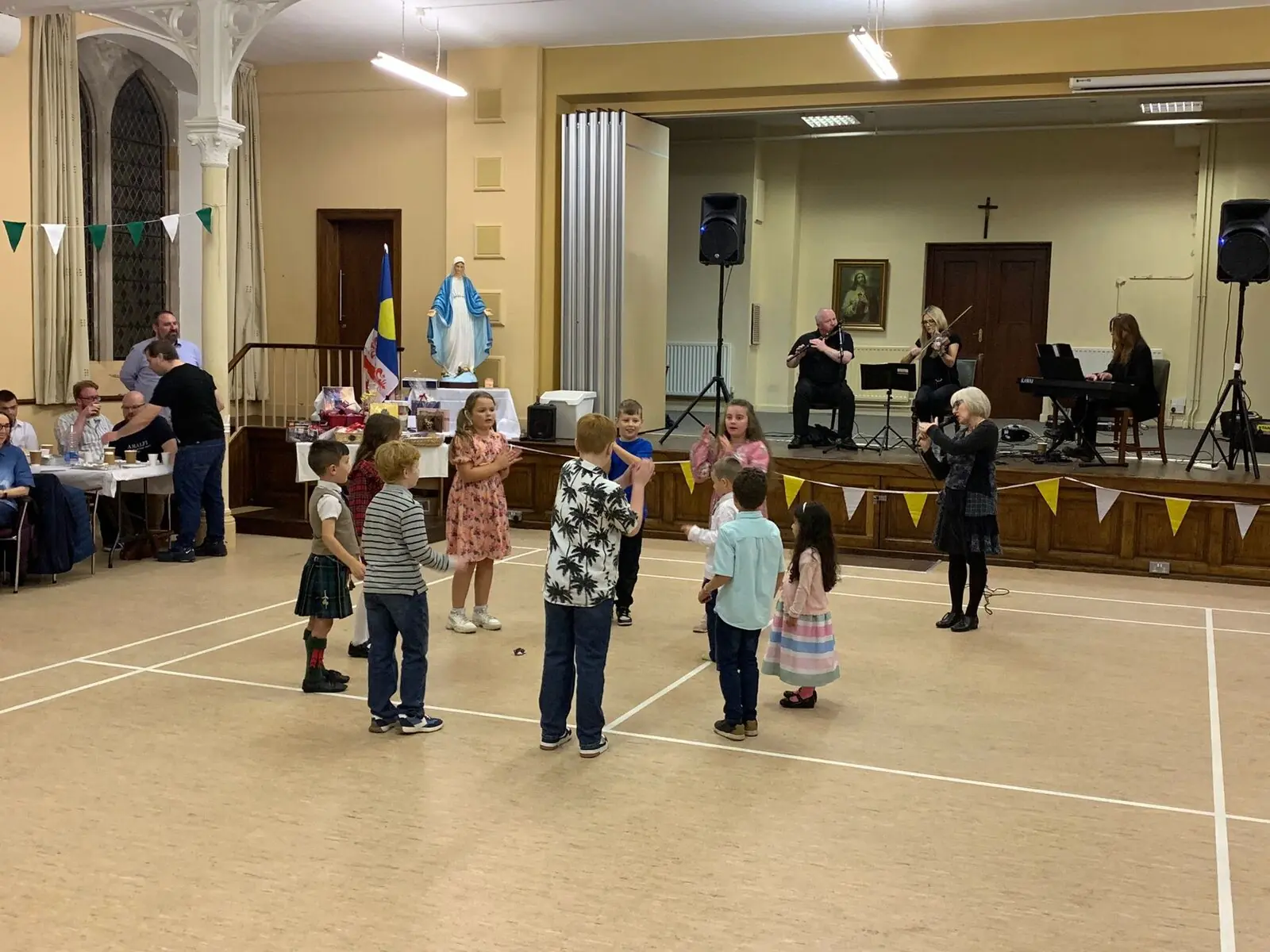 Children dancing with live musicians
