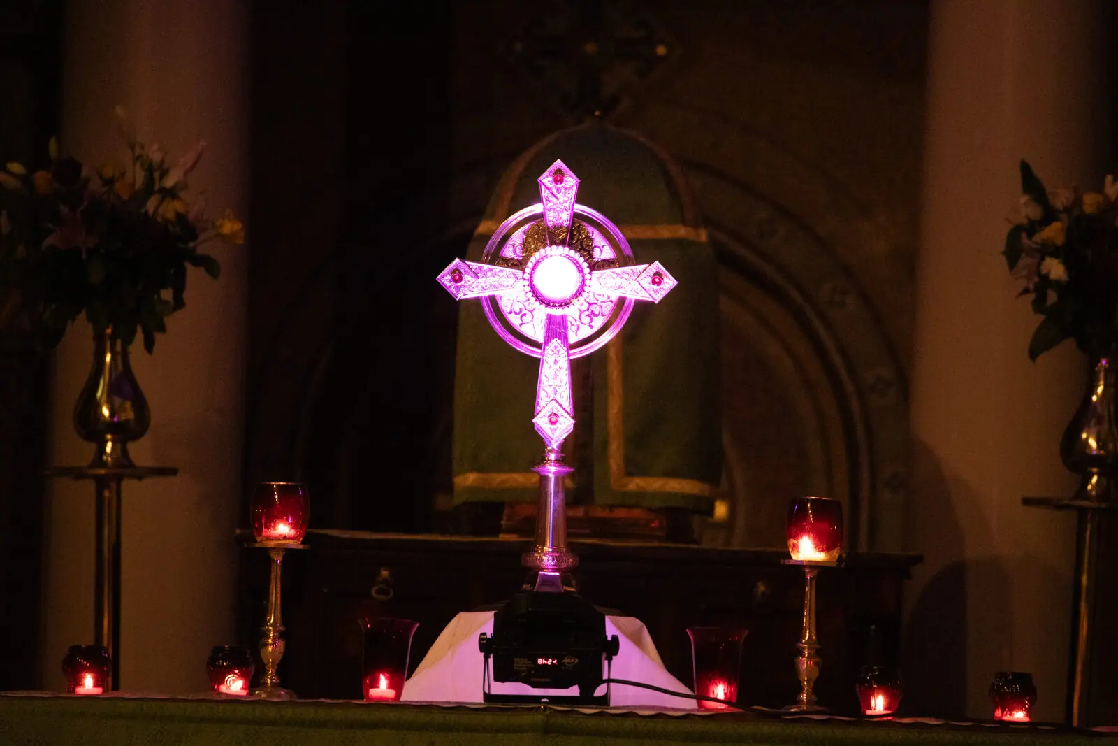 Illuminated cross with candles